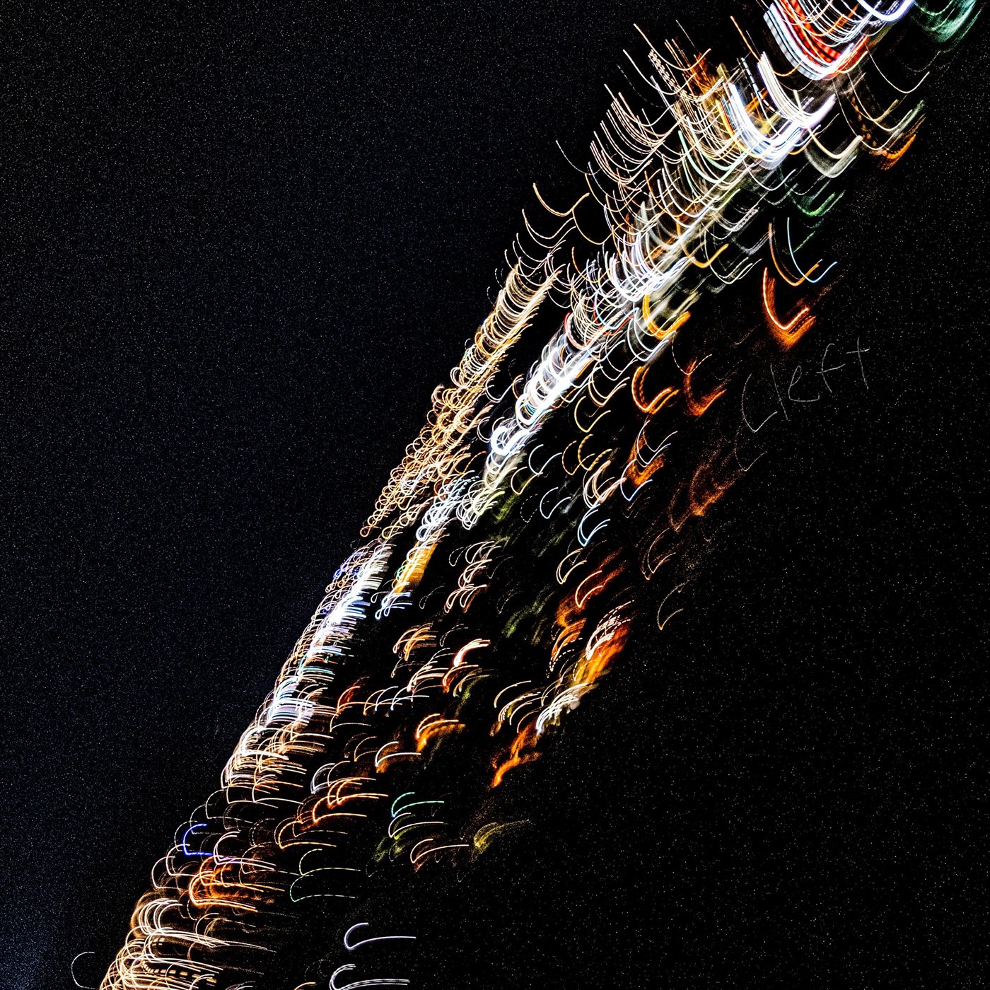 Cleft artwork: streaks of light across a night sky