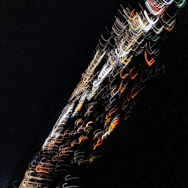 Cleft artwork: streaks of light across a night sky